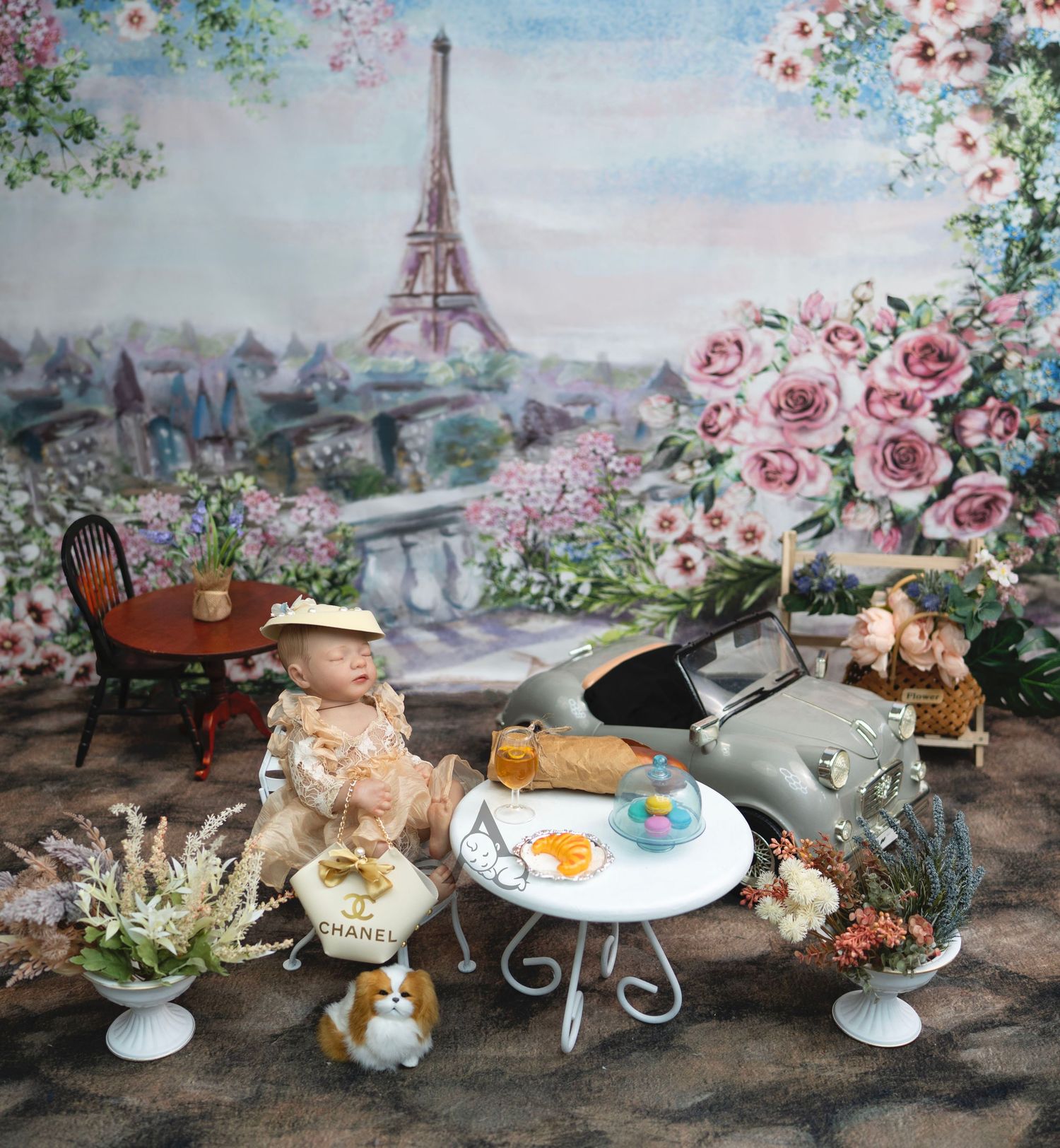 A stylish Chanel storefront decorated with pink roses and luxury shopping bags displayed outside on a table setting.