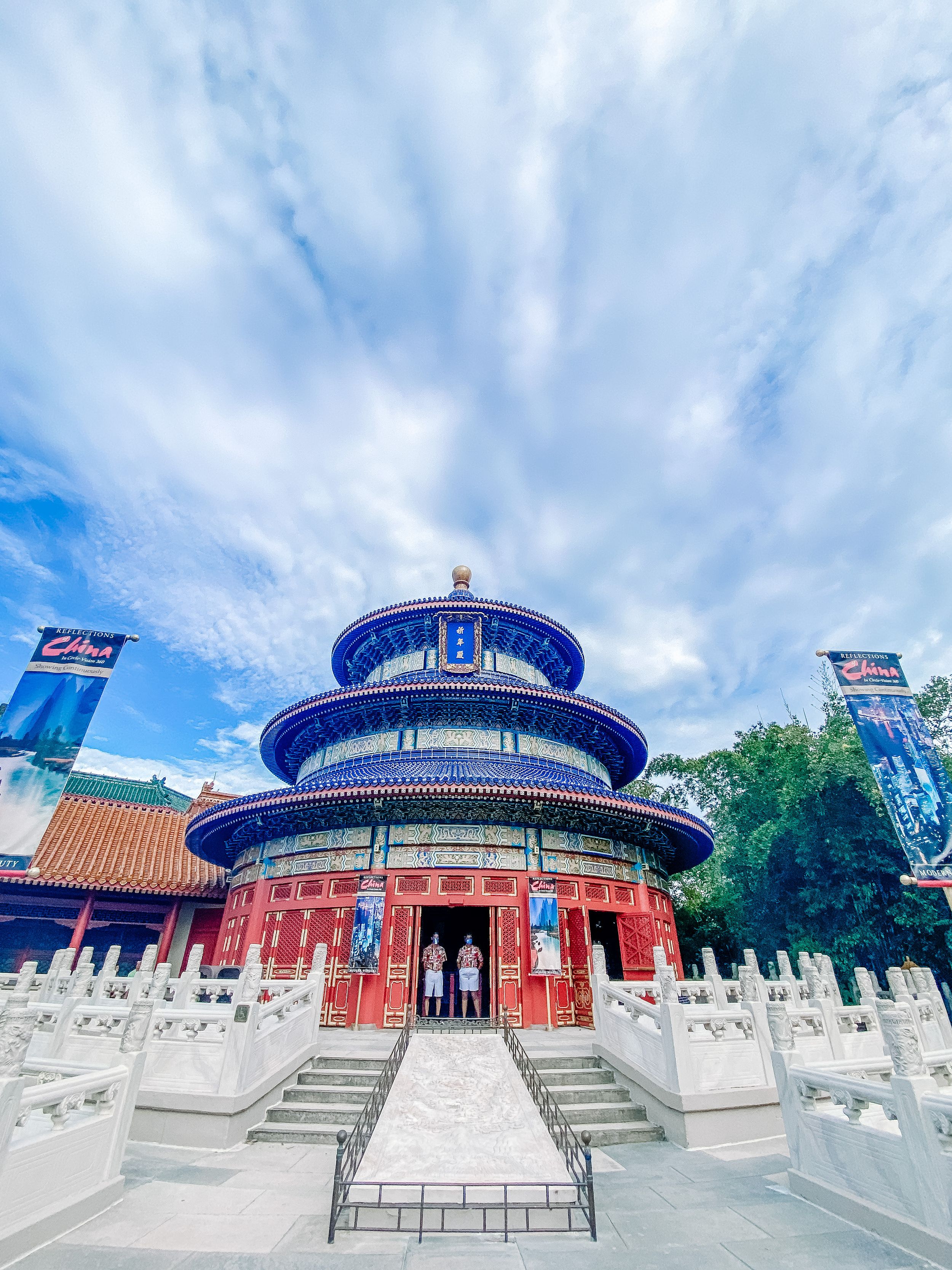Temple of Heaven pagoda in Chinese style with blue and white architectural details under cloudy sky.