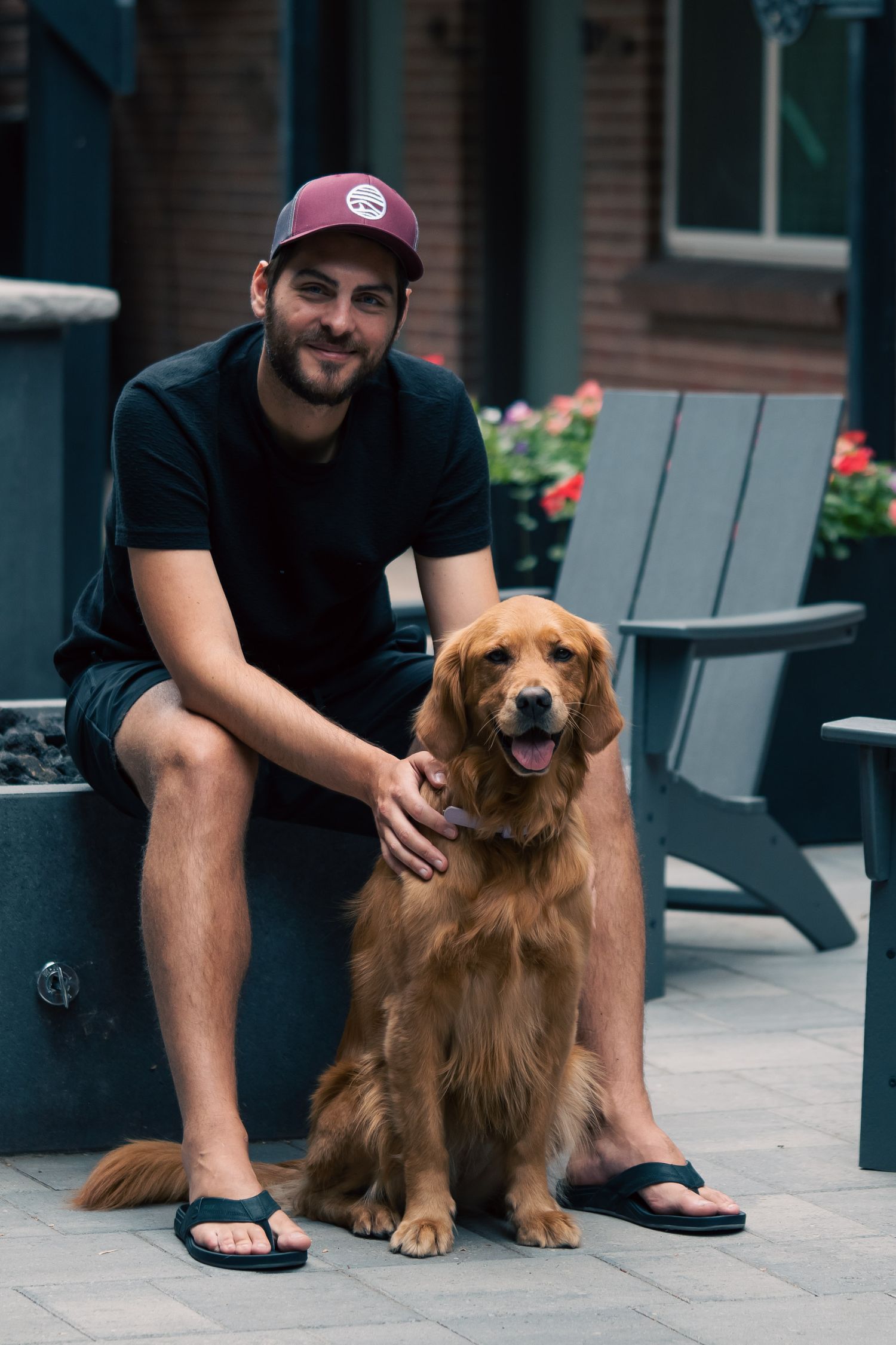 Photographer with golden retriever during outdoor pet photoshoot in Austin
