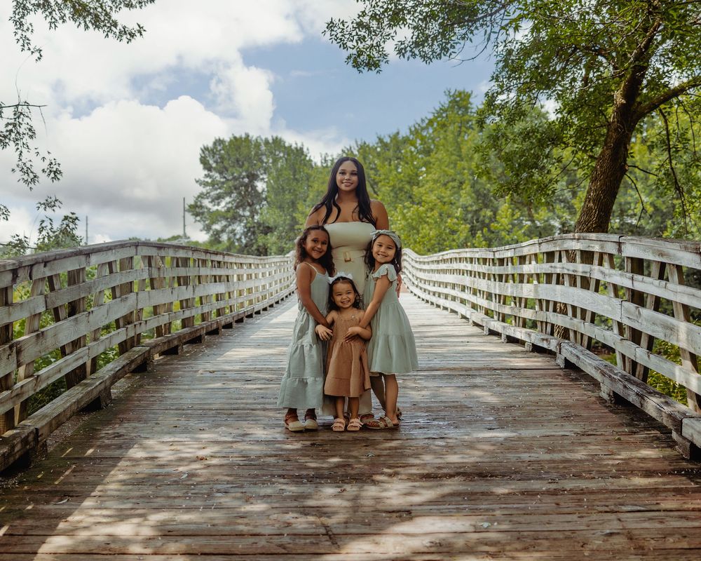 A sequence of six photos shows a group walking along a sun-drenched wooden boardwalk through lush green trees.