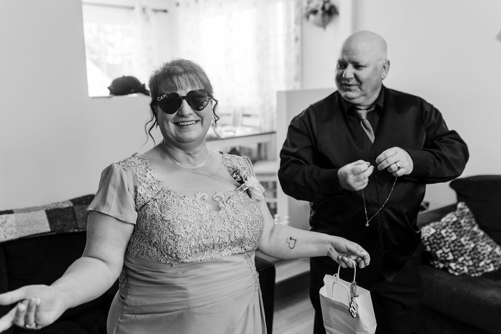 A creative collage of intimate wedding moments showing hands, rings, and tender gestures in black and white photography.
