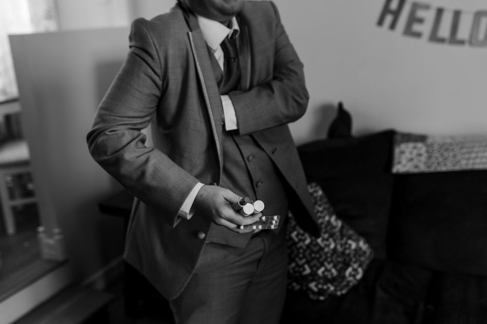 A collage of black and white fashion photography shots showing formal attire and accessories against plain backgrounds.
