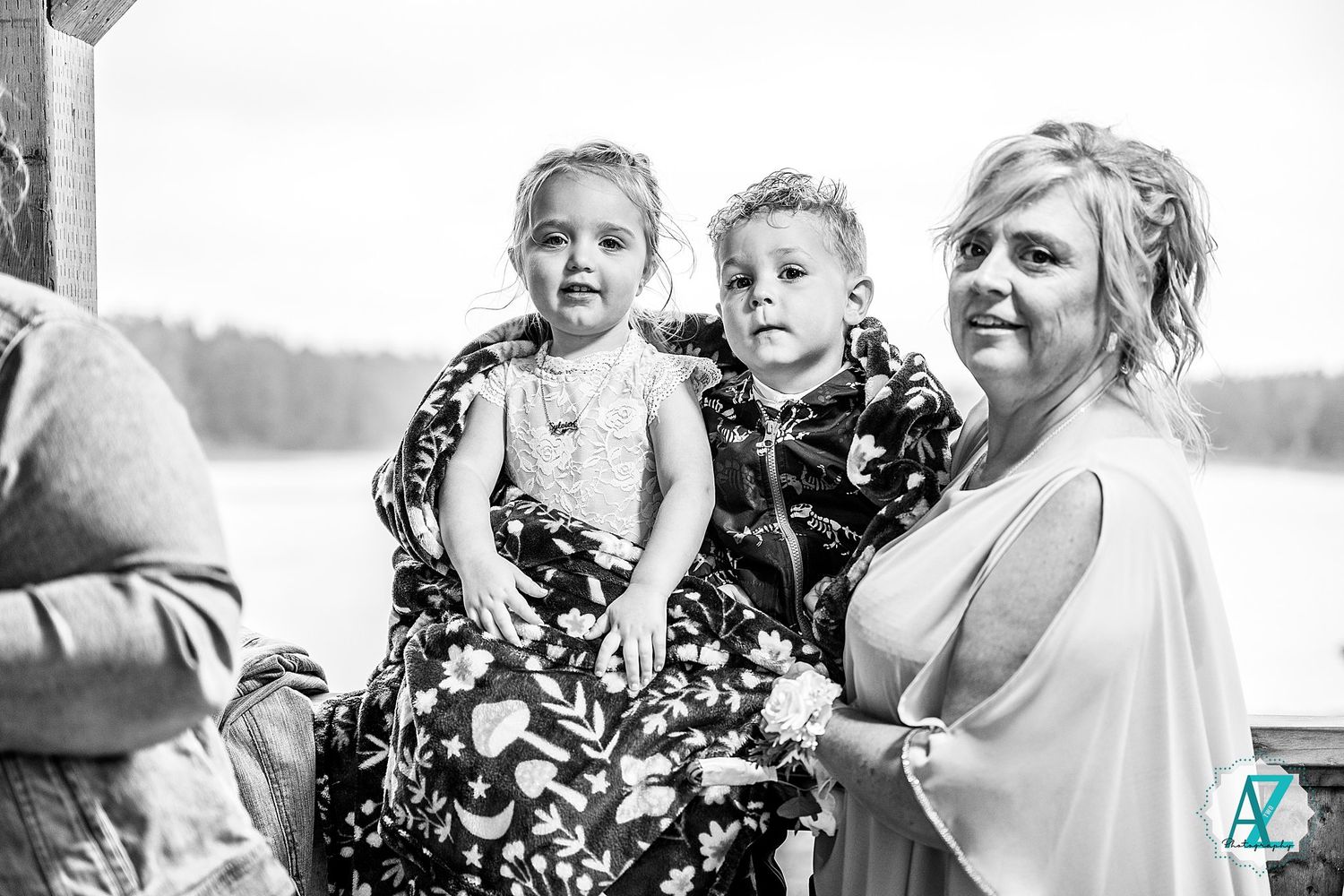 Black and white photo collage of joyful wedding moments captured outdoors in candid style.