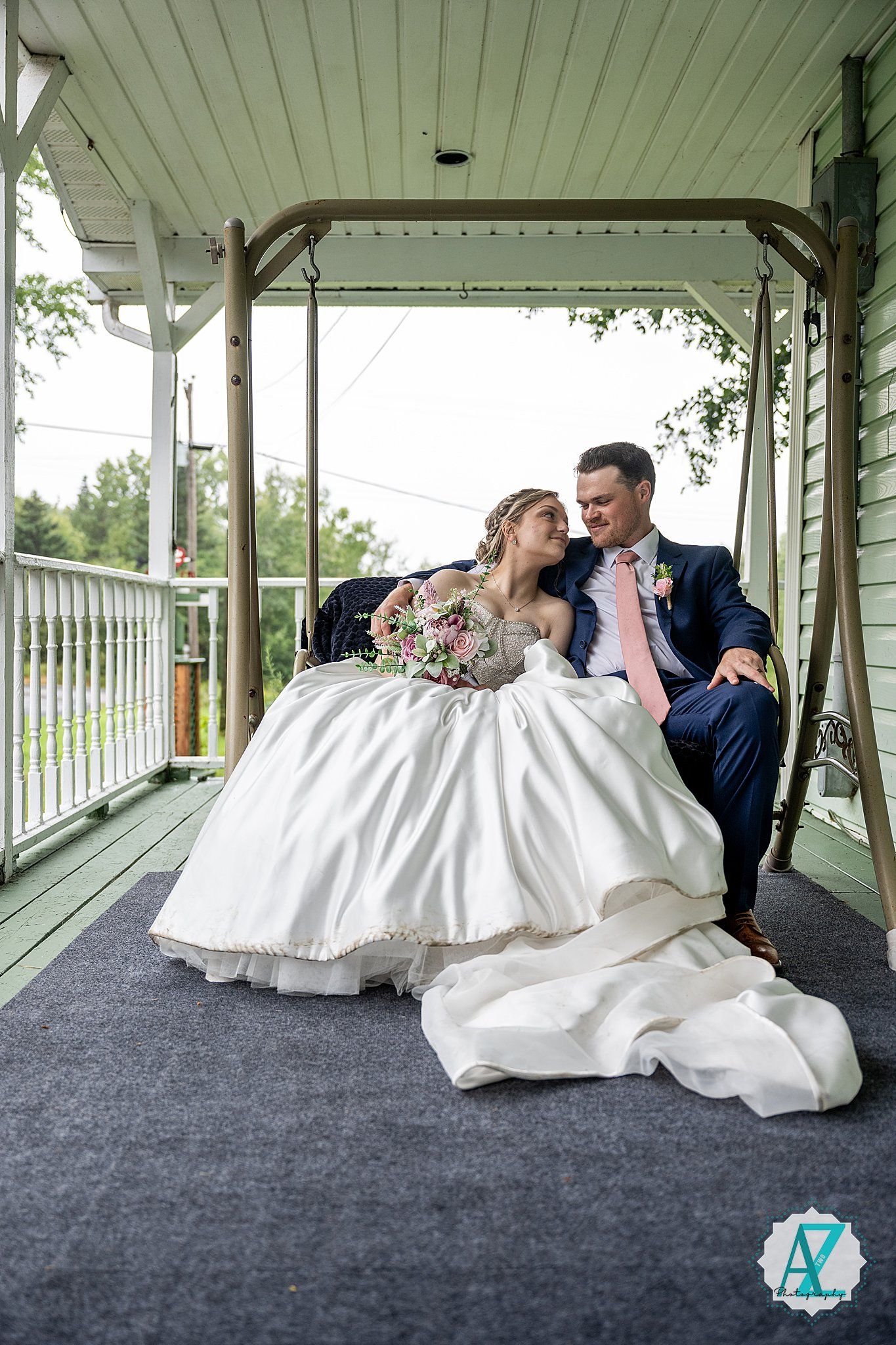 Romantic wedding photography series showing couple in white dress and navy suit posing on covered porch setting.