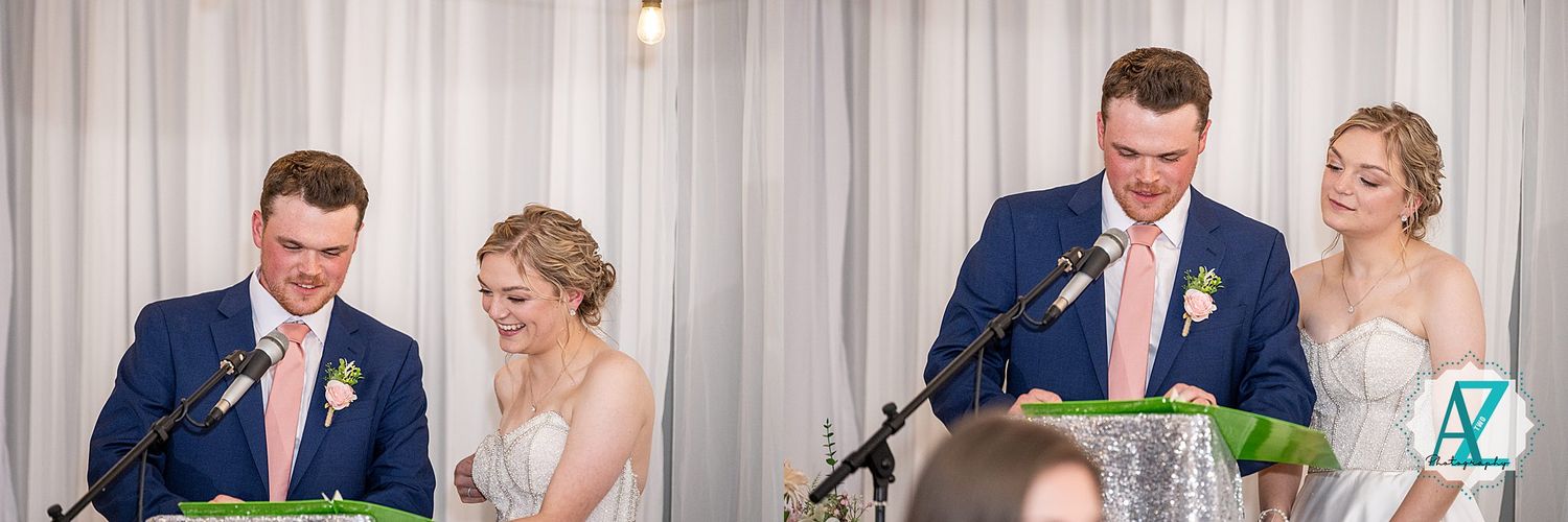 A couple shares a lighthearted moment while giving speeches at their wedding reception.