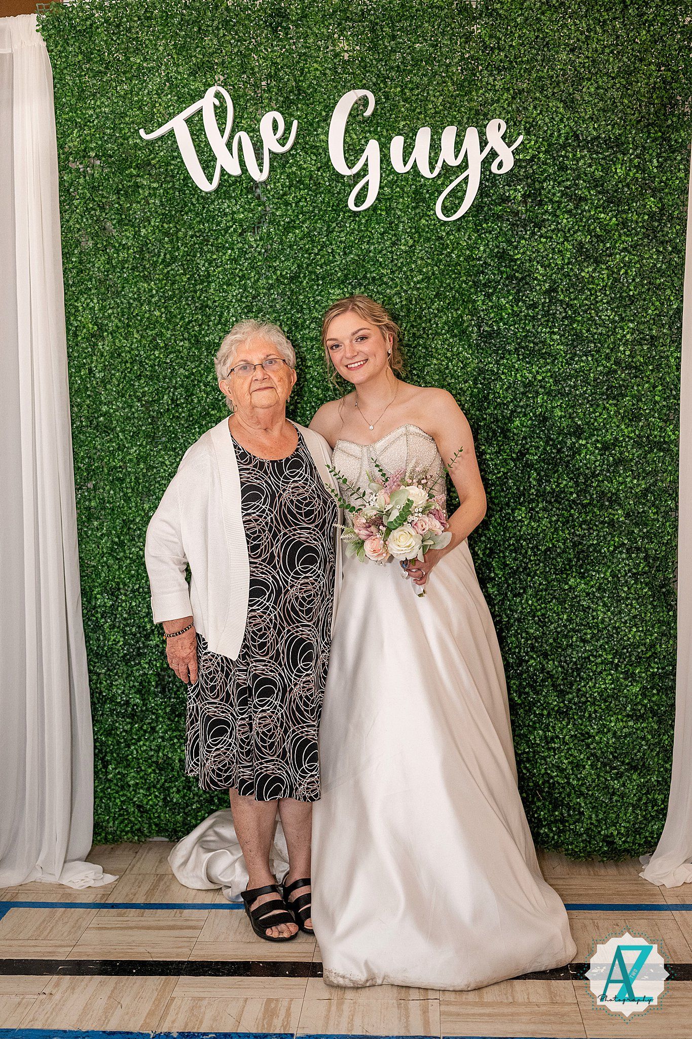 A wedding photo series against a lush green hedge wall with white curtain draping shows tender moments in formal attire.