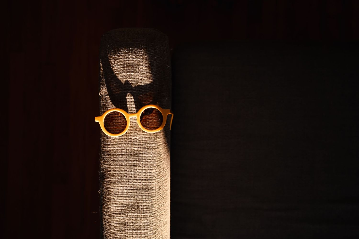 A Tulsa family photography moment captures the details of childhood life with sunglasses left in a patch of sunlight.