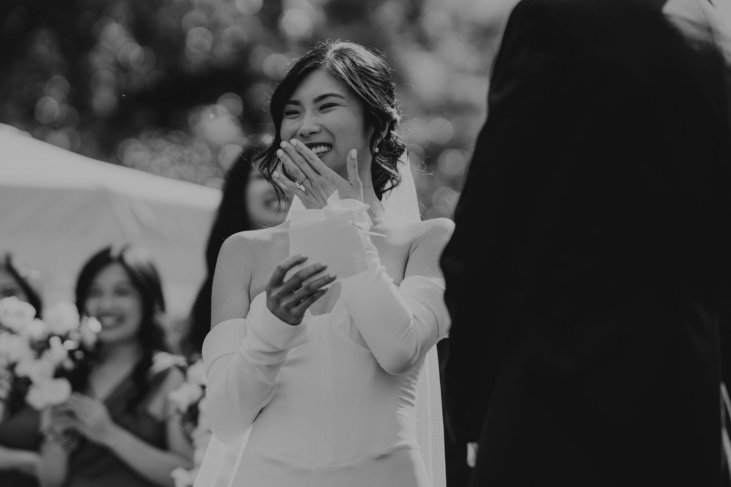 Wedding party members celebrating and reacting with joyful emotions.