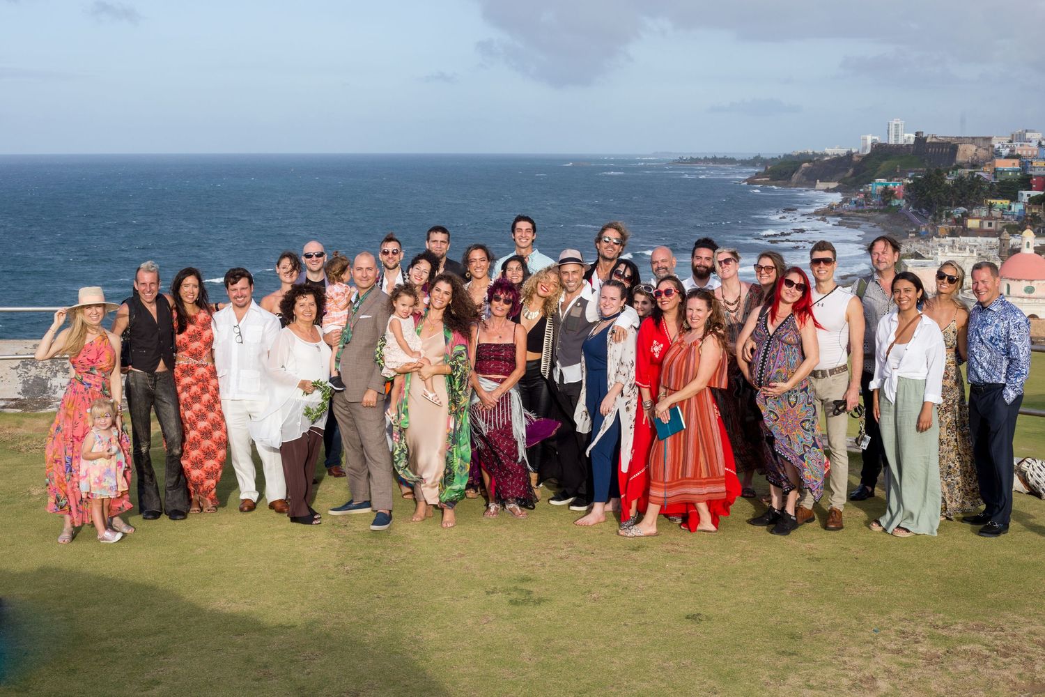 Surprise wedding. Bride, groom, and wedding guests. El Morro. Old San Juan, Puerto Rico.