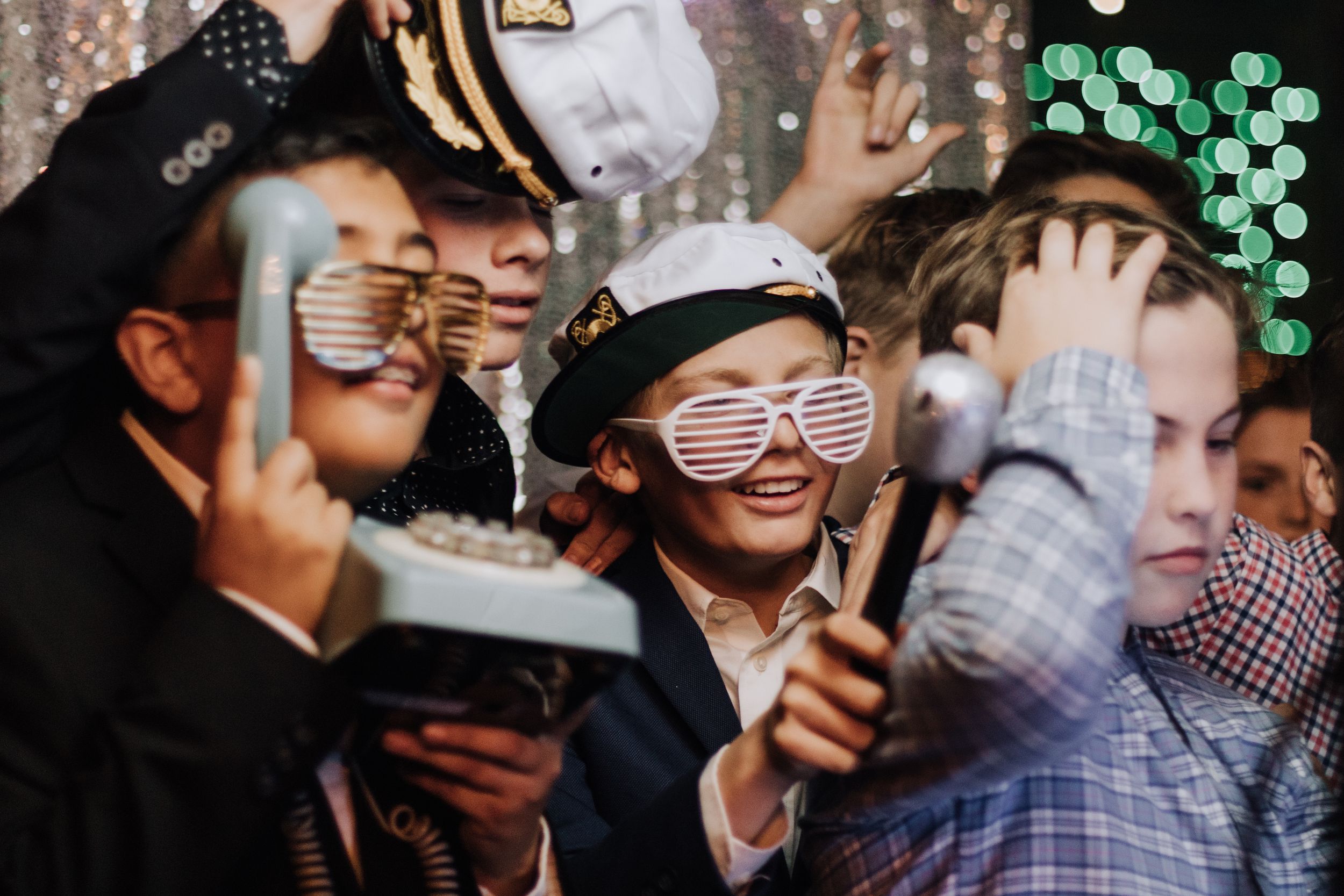 Group of boys wearing photo props at a Bar Mitzvah event in Los Angeles