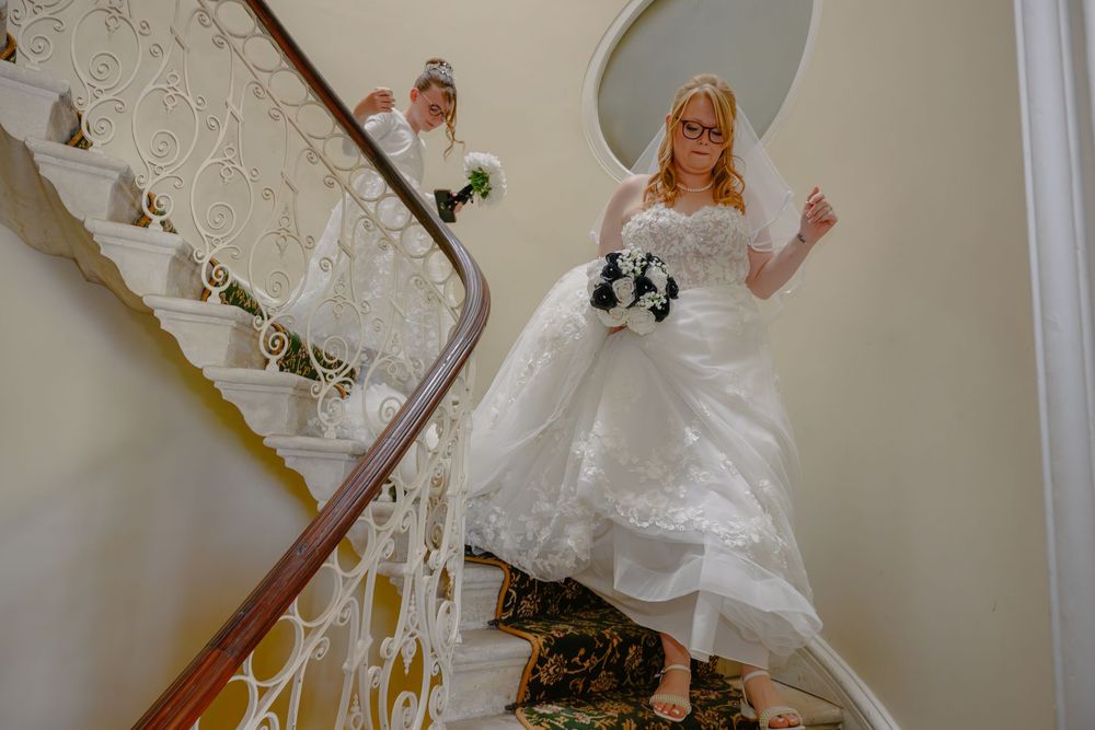 A sequence of playful images showing the train of a white wedding dress swirling on a staircase.