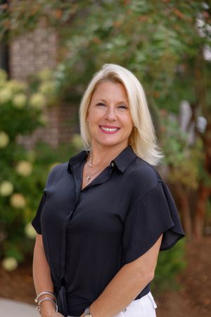 Portrait photo session outdoors showing three artistic poses in formal business attire against natural foliage background.