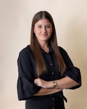 Professional portrait series showing different poses in a black button-down shirt against a neutral backdrop.