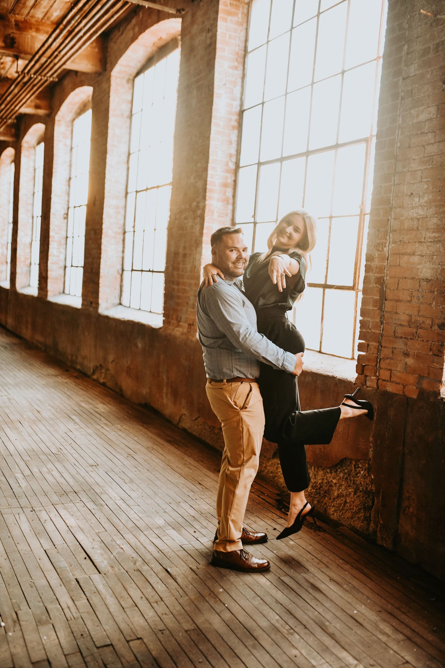 Warm golden hour engagement portraits at Cotton Mill in McKinney TX