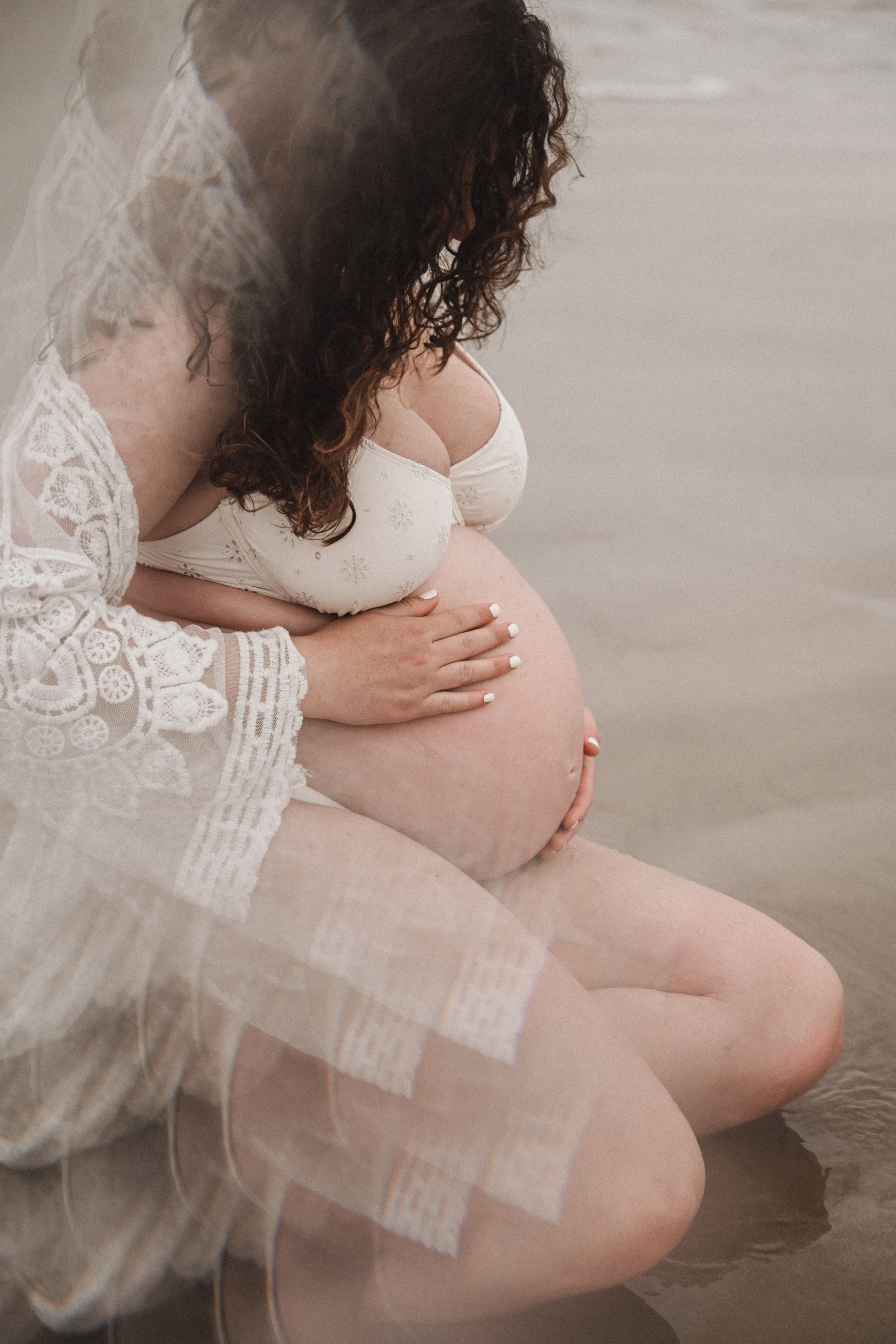 Romantic boudoir photography showcasing delicate lace details and soft lighting.