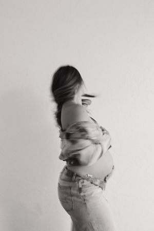 A series of black and white photos showing motion and fabric movement against a white background.