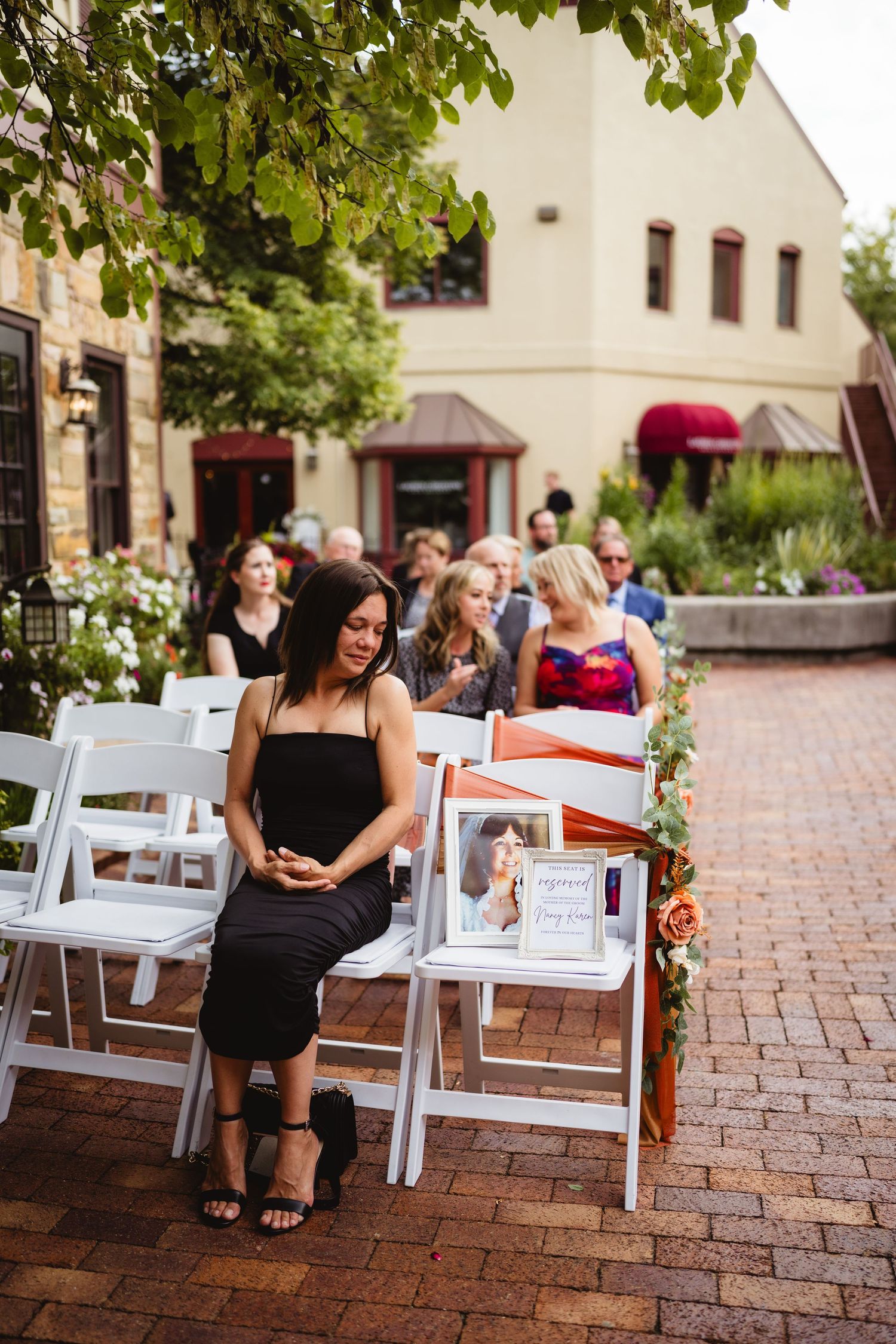 A sequence of photos showing someone sitting on white outdoor chairs along a brick paved courtyard area.