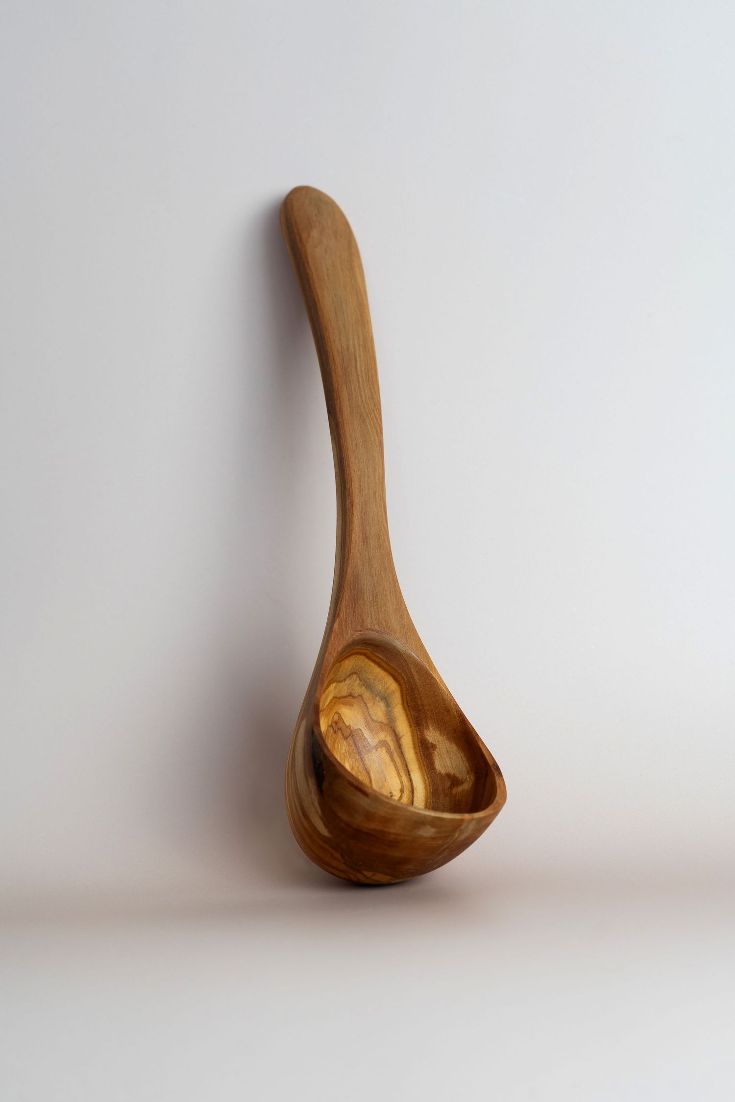 studio pack shot photo of wooden spoon on neutral background