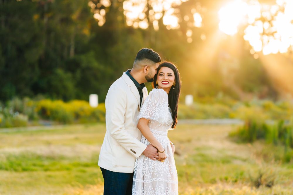 Intimate couple portrait during golden hour in outdoor setting.