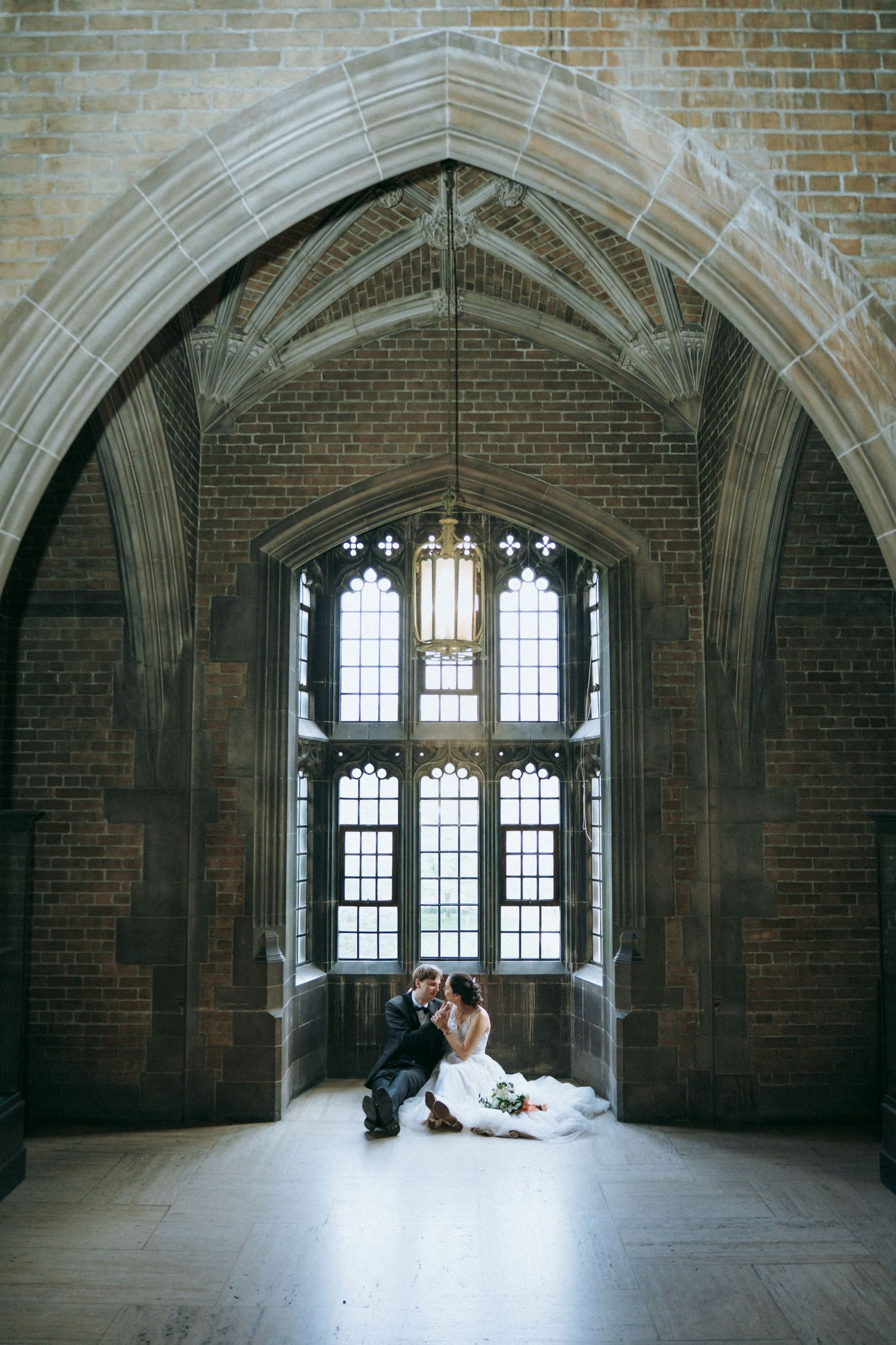 Elegant indoor wedding photography at Hart House in Toronto, capturing romantic moments.