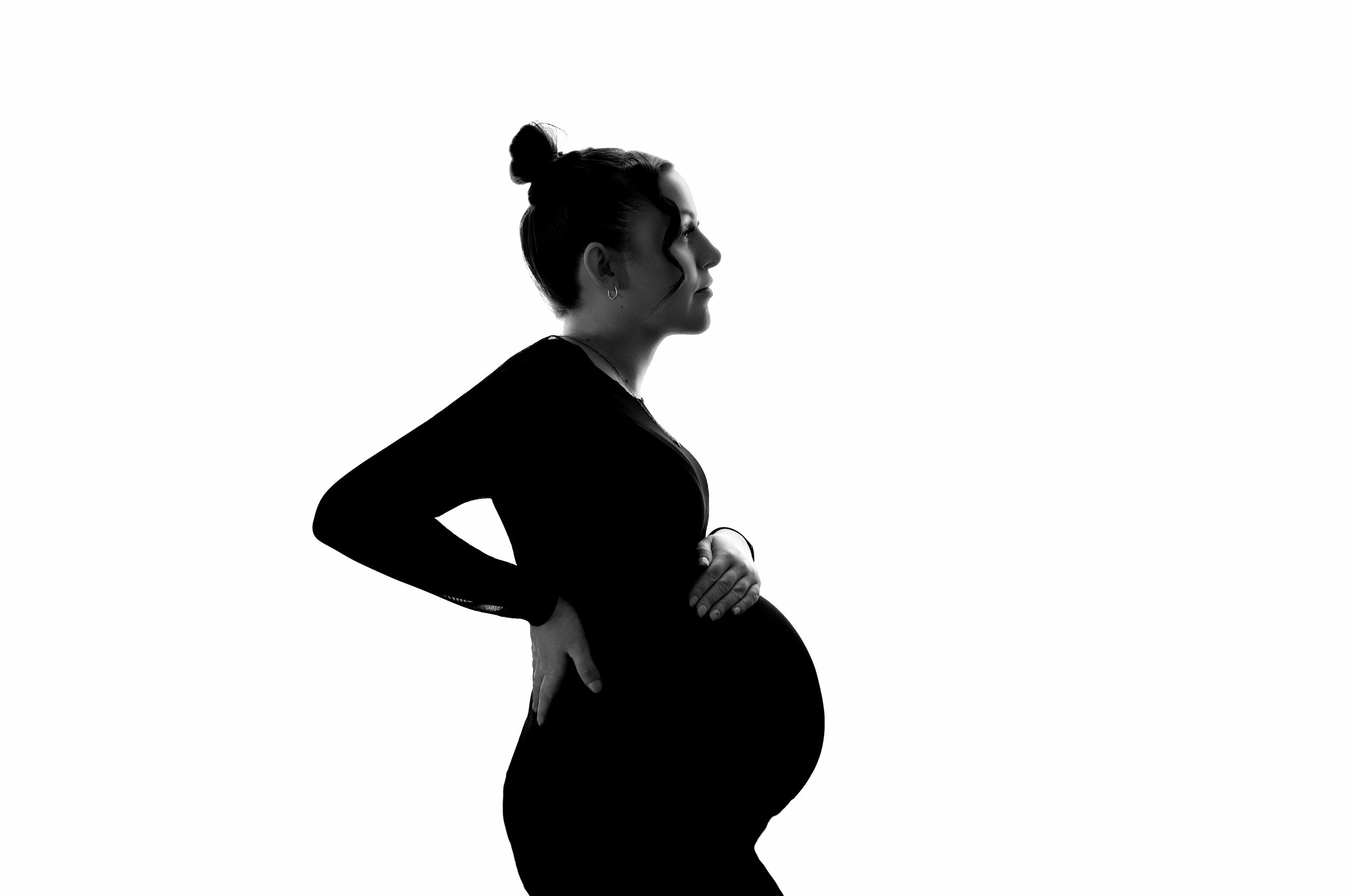 Expectant mother in flowing dress during maternity photoshoot in Haverhill Suffolk