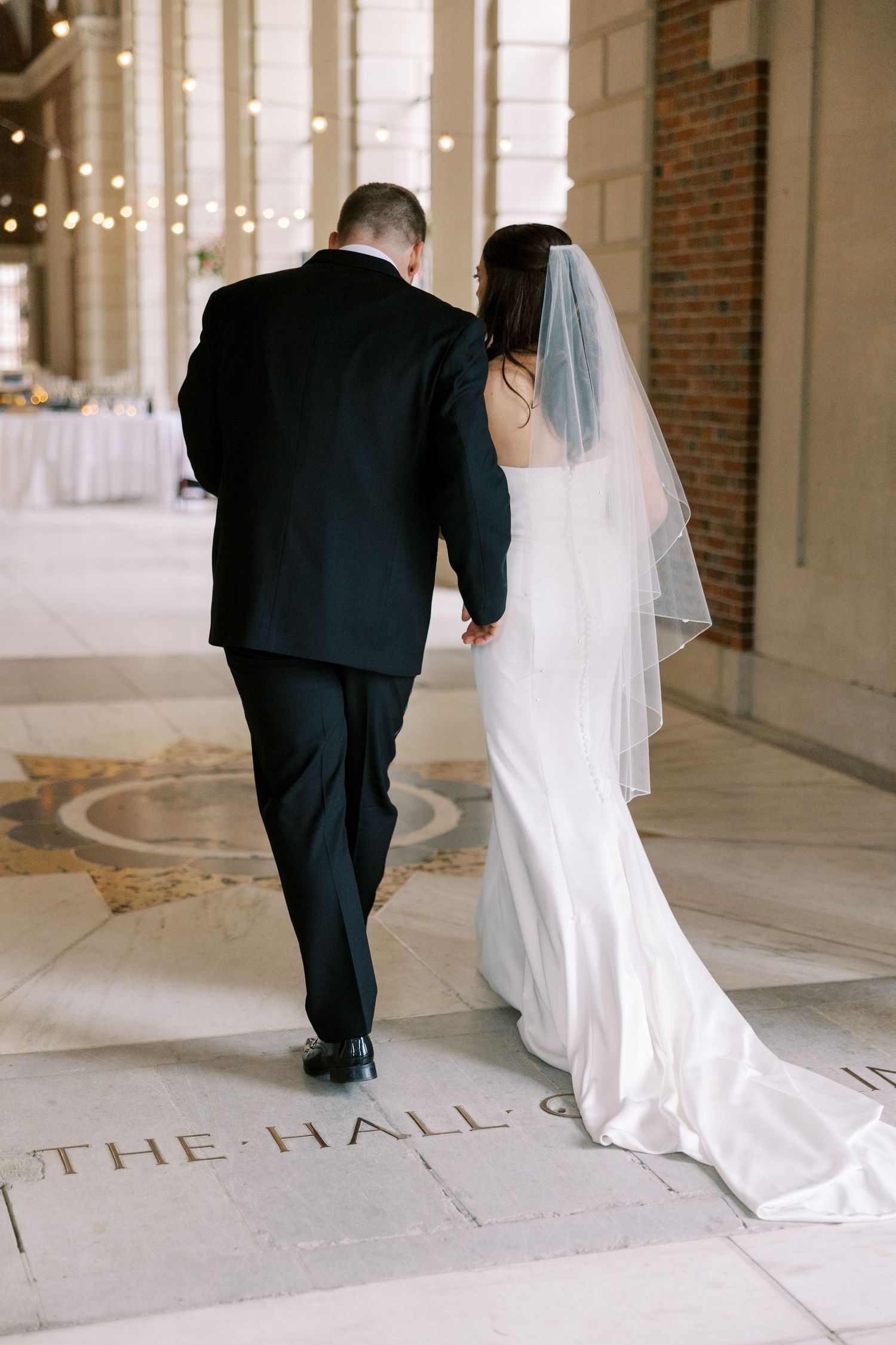 Newlyweds walk down the aisle at an elegant ceremony at the Hall of Springs in Saratoga Springs, New York.