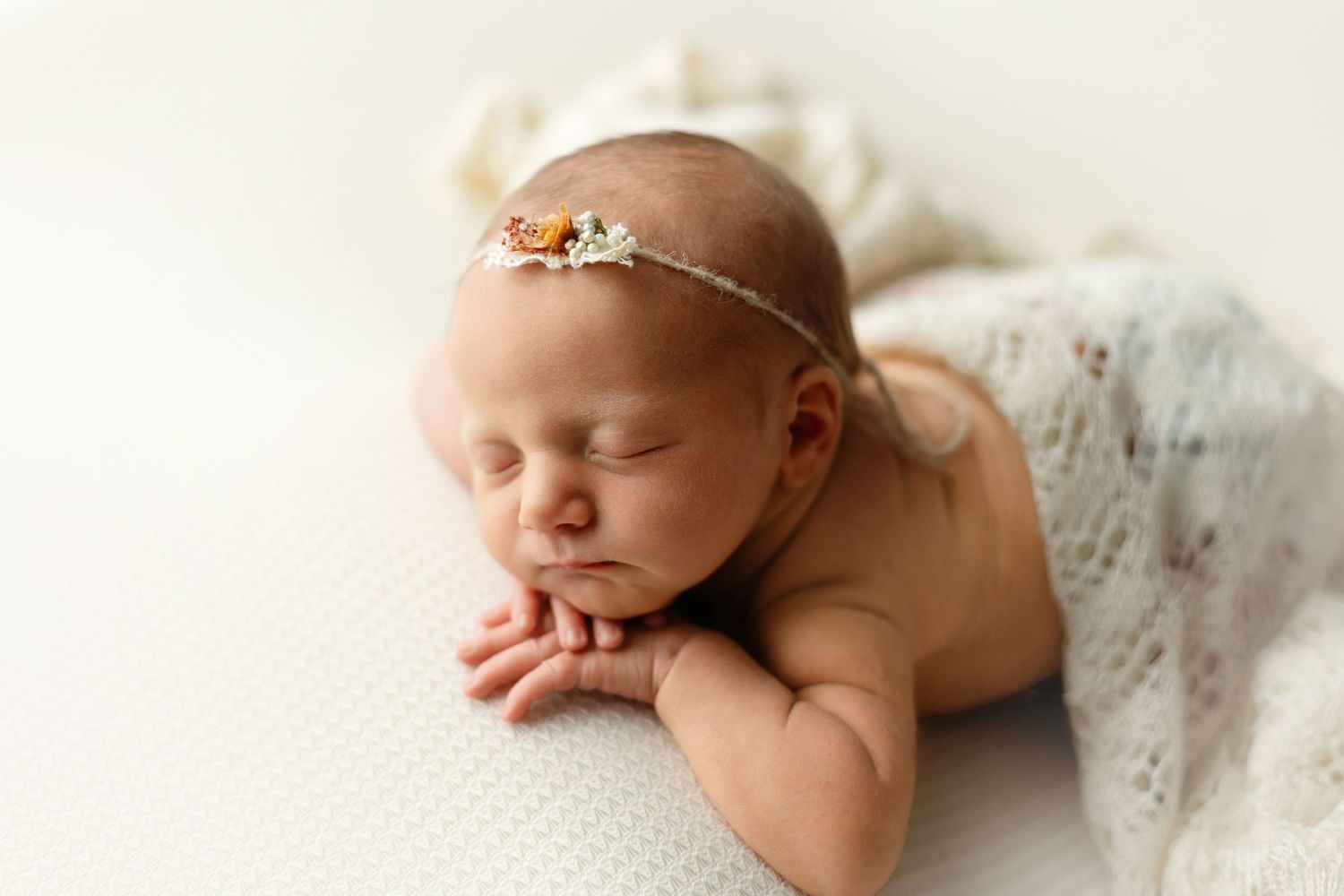 Newborn baby girl doing the chin-on-hands pose. Greenville SC newborn photographer, Easley SC newborn photographer