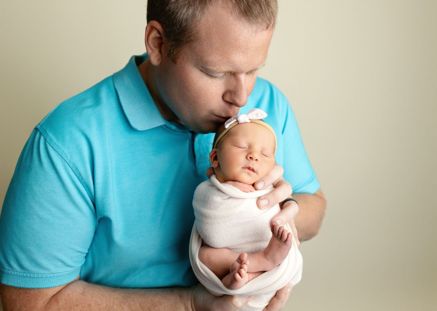 Dad kissing newborn baby girl. Greenville SC newborn photographer, Easley SC newborn photographer