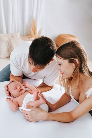 Intimate family moment captured on white background.
