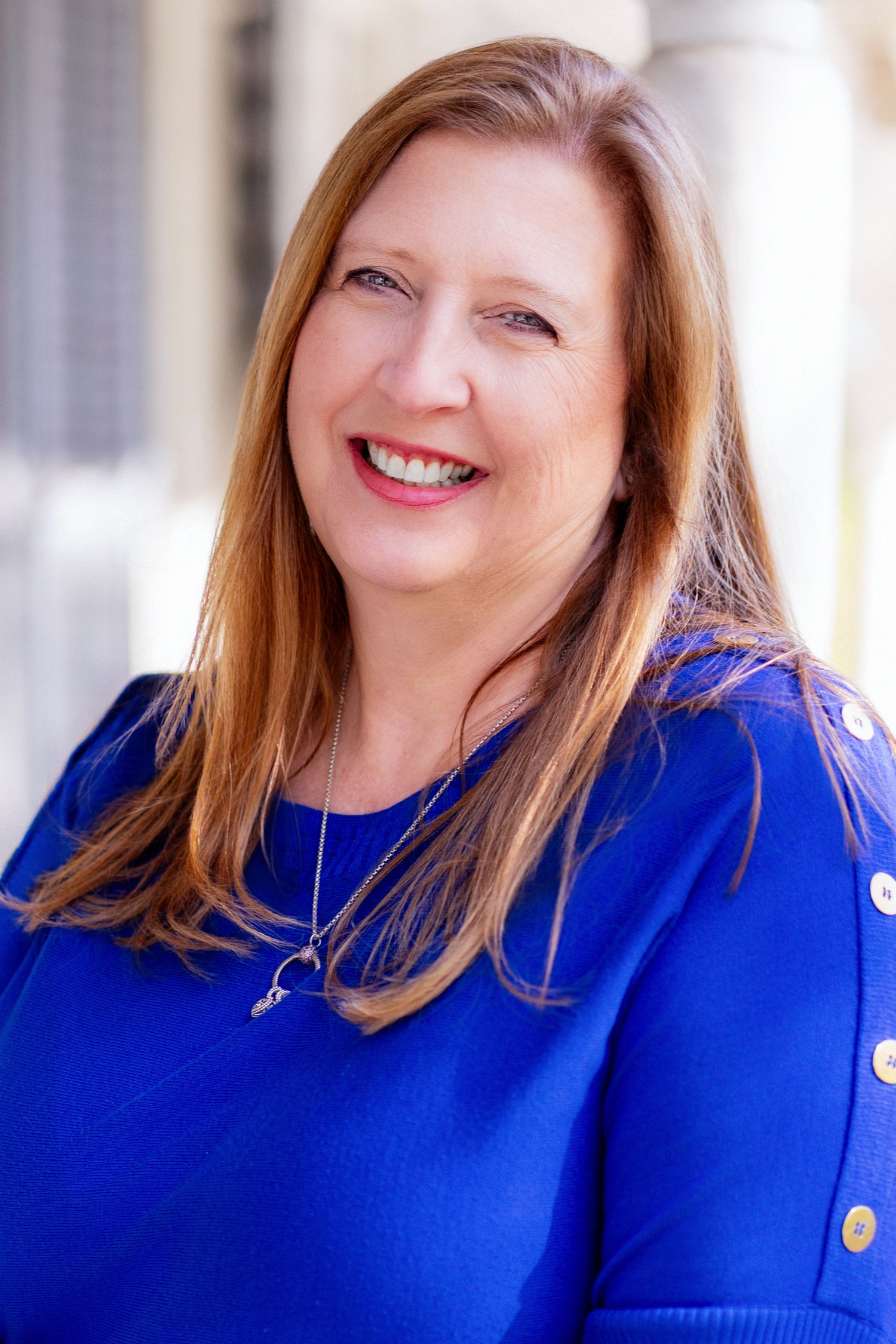 Environmental headshot of East Tennessee realtor taking in downtown Dandridge, TN by headshot and personal branding photographer