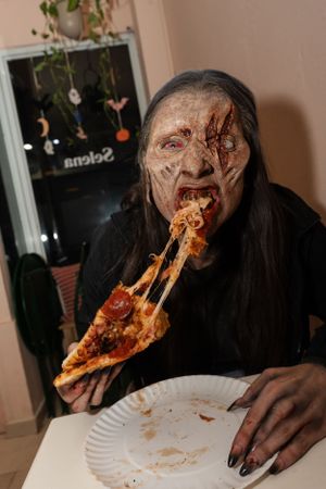 Zombie eating a pizza. Zombie eating a pizza.