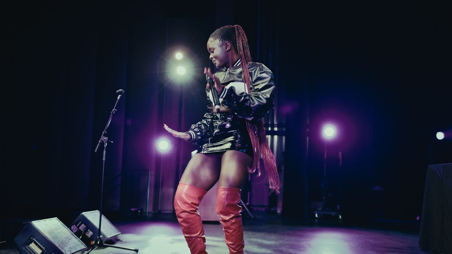 Photograph of performer dancing on stage