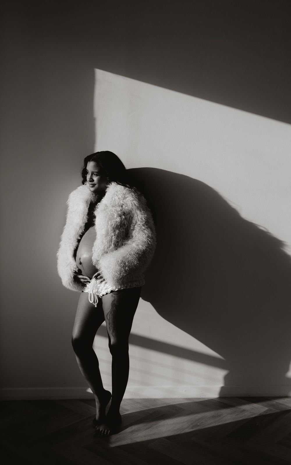 Artistic black and white photos showing shadows and movement with white fluffy texture.