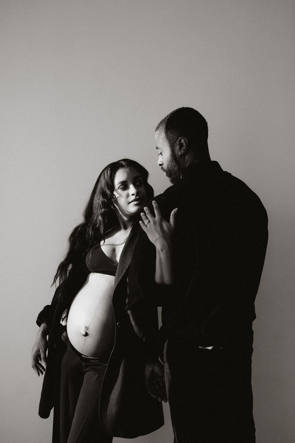 Artistic black and white sequence showing silhouettes of a couple in an intimate moment.