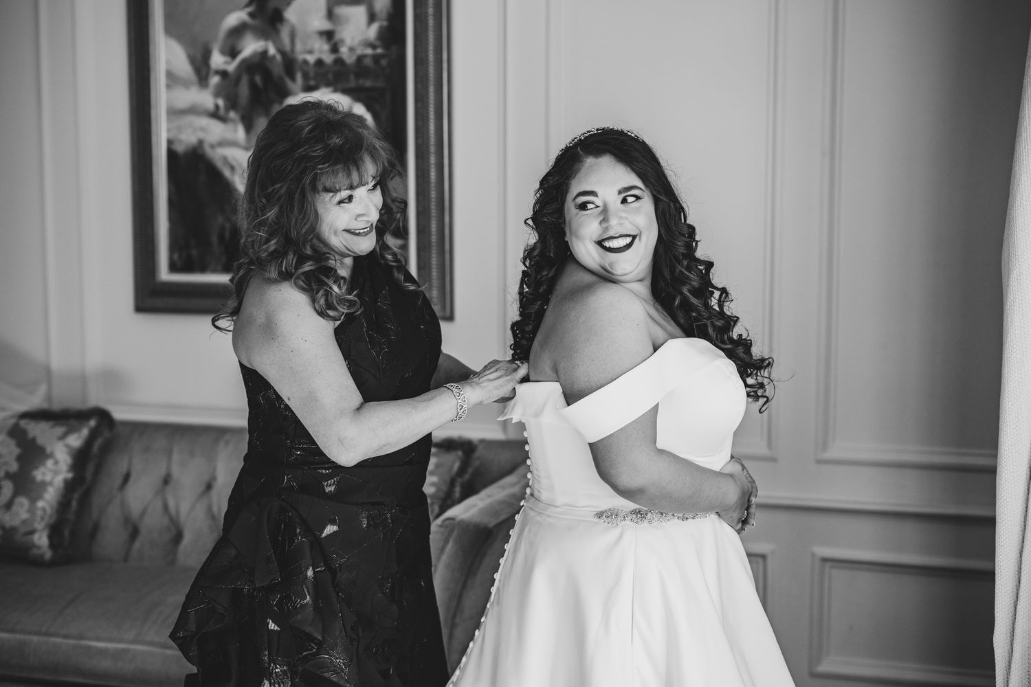 Wedding party members share candid moments during preparation time.