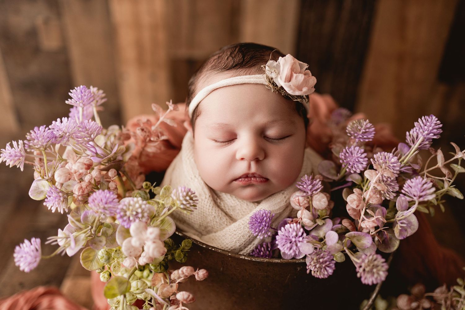 Newborn portrait in Urso Photography’s studio, capturing the sweet details of a newborn in a cozy, natural setting in Chattanooga.