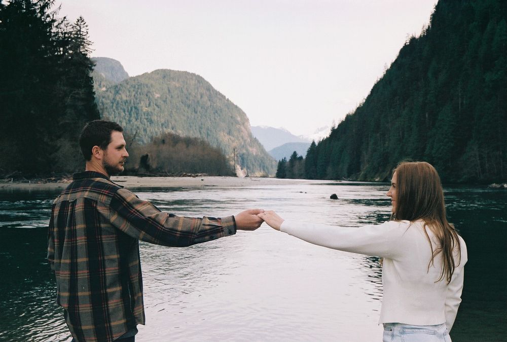 Series of romantic moments captured against scenic mountain lake backdrop.