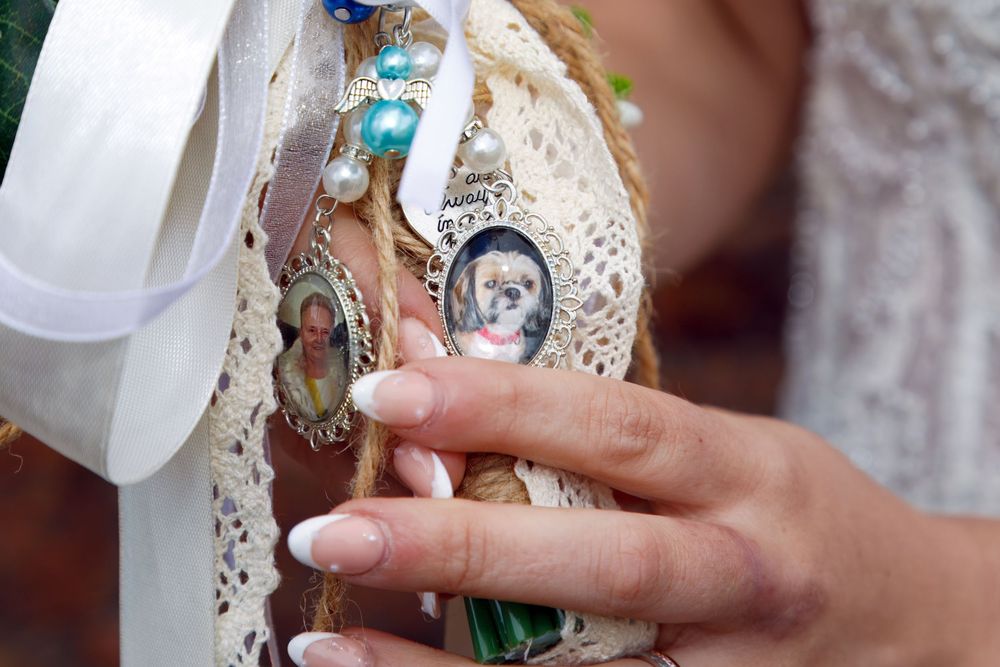Close-up of decorative charms and mementos attached to a bridal bouquet.

Knowsley Registration Office