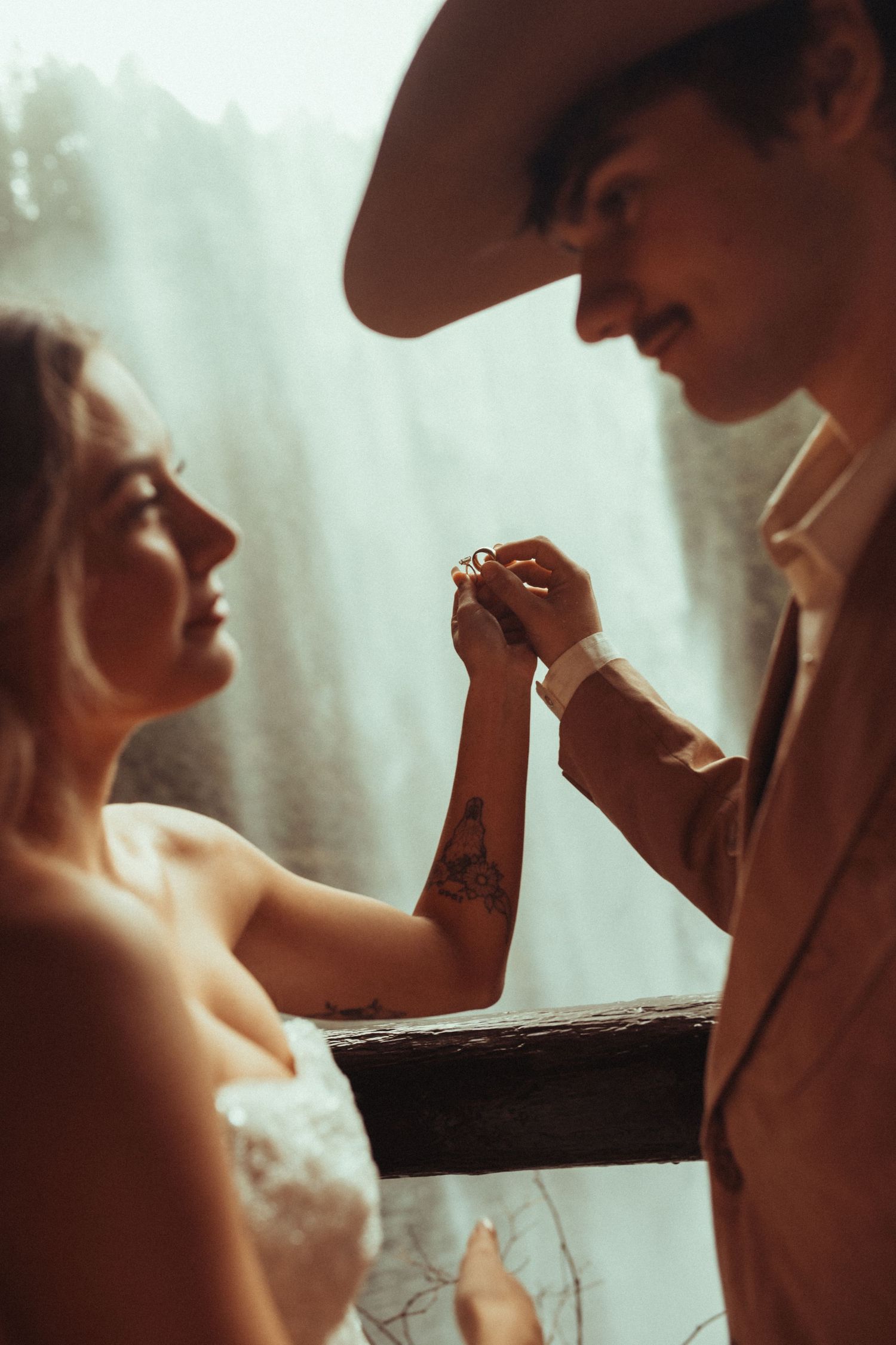Romantic silhouette of a couple in an intimate moment against a soft, dreamy background.