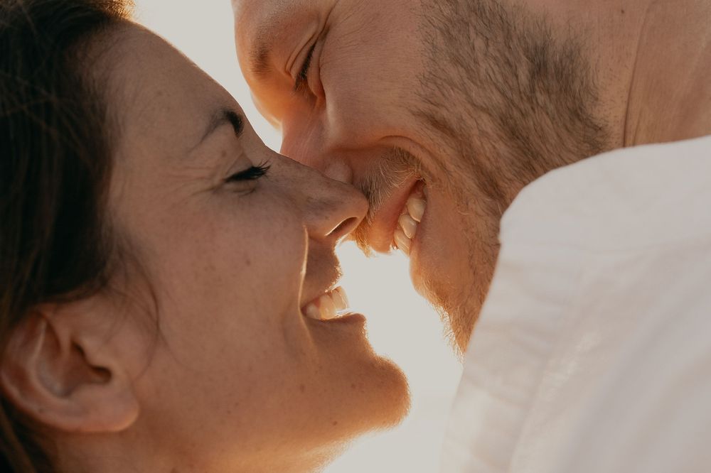 Intimate close-up photography with warm lighting and soft focus.