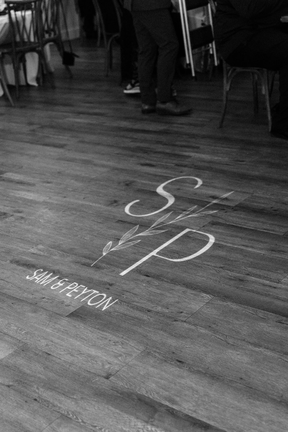 A series of black and white photographs showing text written in chalk on a wooden floor.
