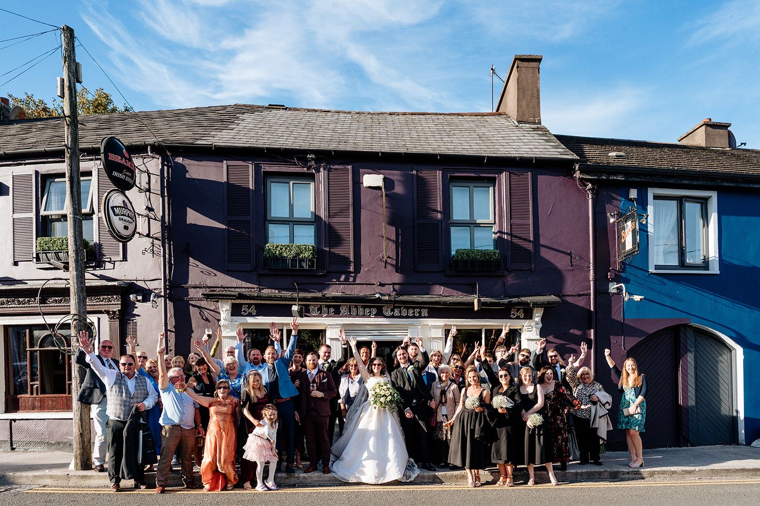 The wedding party and guests gathered outside a Cork Pub for a Cork City Wedding