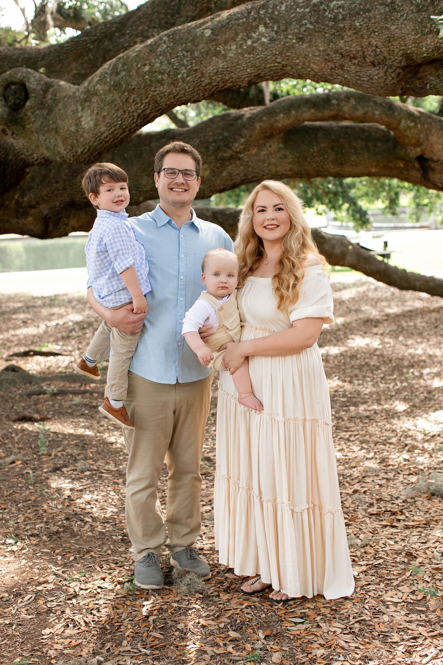 Lindsay with her husband and two young sons under a live oak tree in the South Carolina Lowcountry