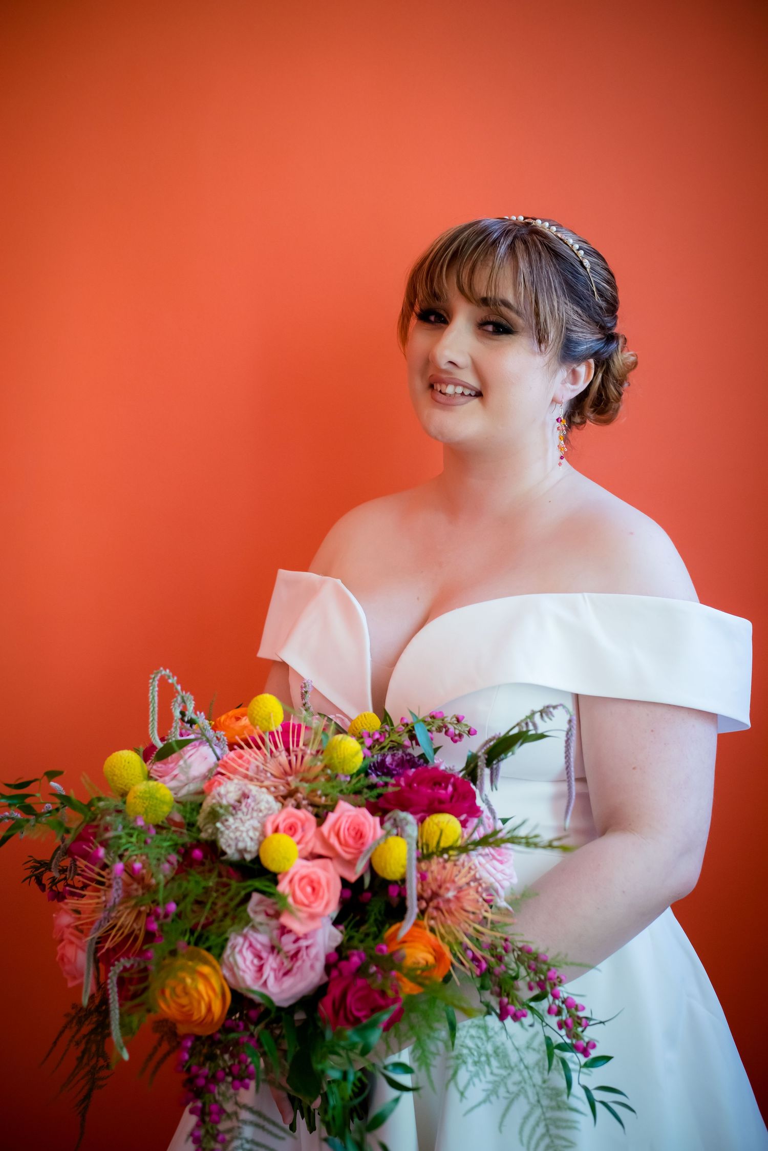 Portrait of a bride with her bouquet at HI Sacramento. Photo taken by Northern Californian Wedding Photographer, Ashley Nicole Baeza.