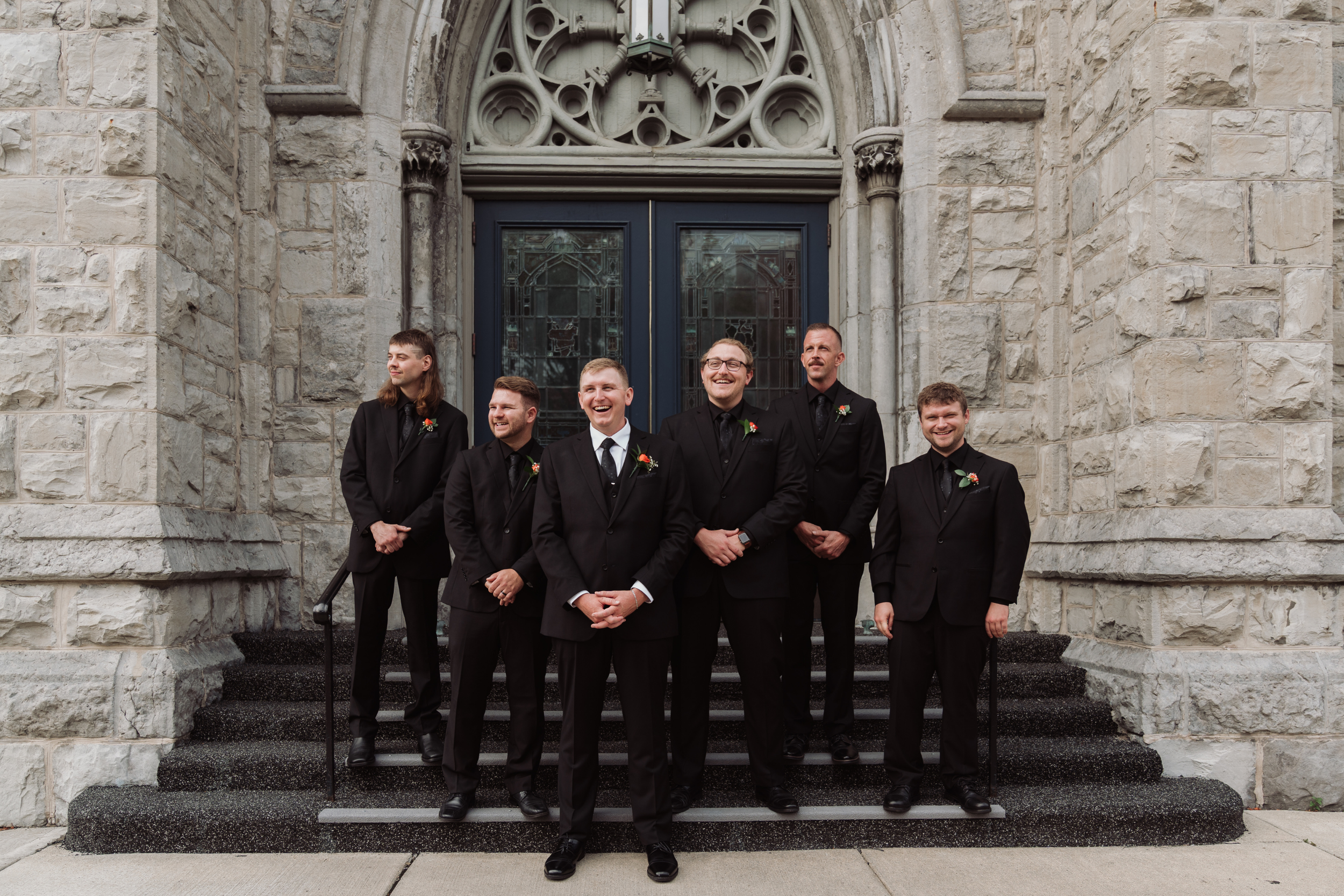 Groom and groomsmen outside St. Mary's Church in Auburn NY