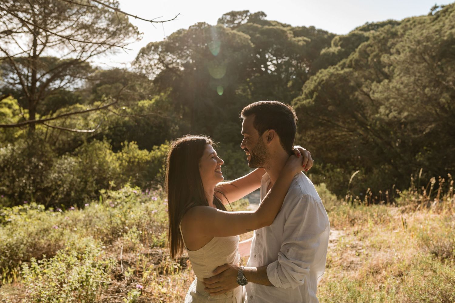 pre-wedding photos in Lisbon at Fonte da Telha beach with couple embracing in natural light