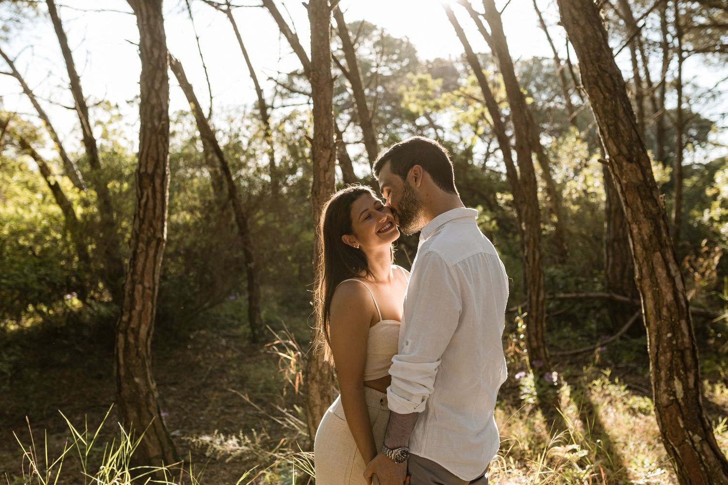 romantic pre-wedding photo in Lisbon with couple holding each other in natural setting