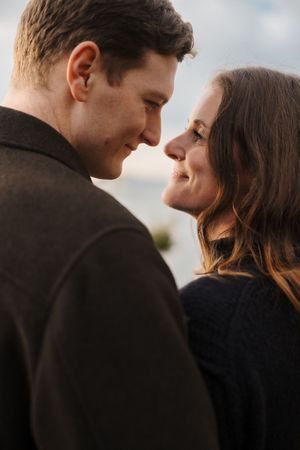 A romantic series of close-up shots showing a couple in silhouette against a bright sky sharing intimate moments.
