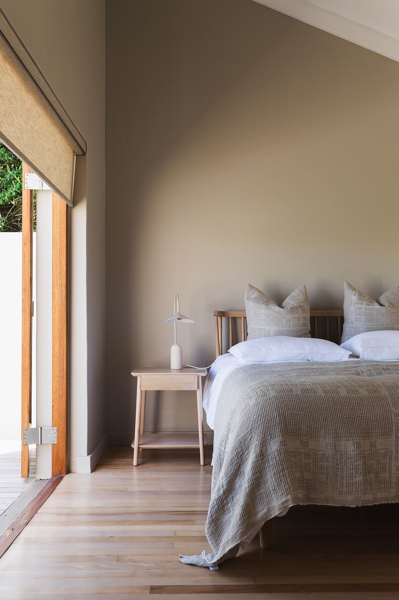 Serene bedroom with neutral tones and soft natural light in Hermanus home