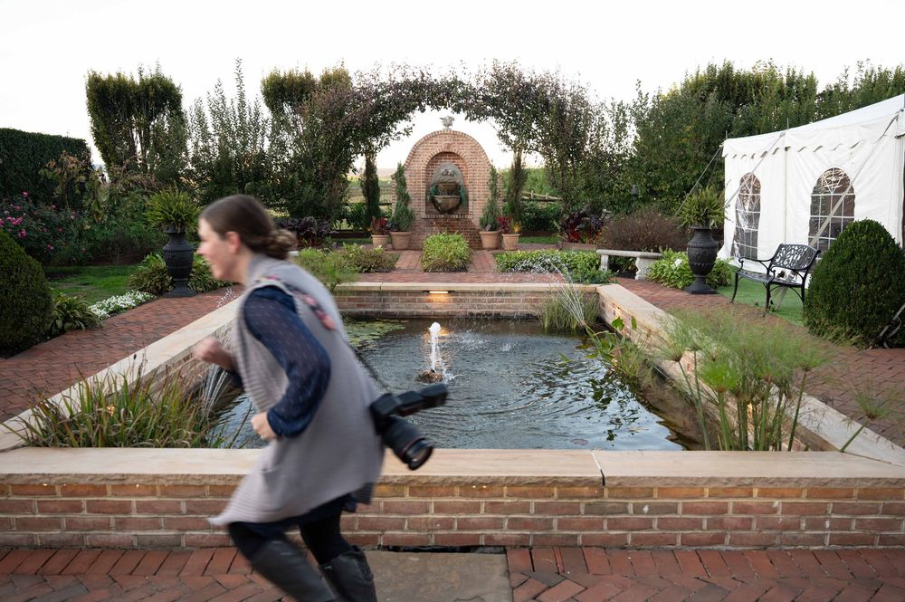 A sequence of images shows someone performing a parkour move over a brick wall in an outdoor garden setting.